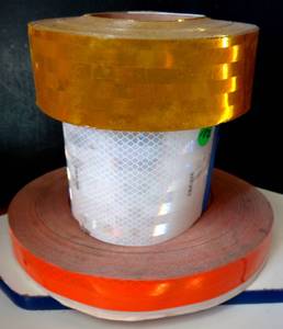 lot 182 image: 3 NEW ROLLS OF REFLECTIVE SAFETY TAPE - GOLD, ORANGE, & WHITE