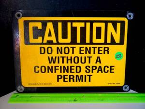 lot 203 image: METAL CAUTION SIGN AS SHOWN