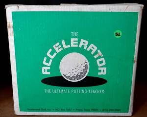lot 312 image: THE ACCELERATOR ULTIMATE GOLF PUTTING TRAINER - APPEARS UNUSED IN BOX