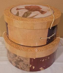 lot 57 image: LOT OF 2 ROUND DECORATIVE STORAGE CONTAINERS IN STYLE SHOWN.