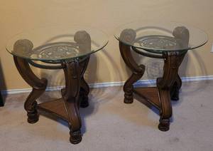 lot 78 image: (2) GLASS TOP WOODEN END TABLES WITH INTRICATE CARVED DESIGN AND WROUGHT IRON ACCENT AS SHOWN. (SOLD 2 X THE MONEY) THESE MATCH LOTS #79 AND #80. EACH APPROX. 24W x 26.5 H (WITHOUT THE GLASS ON)