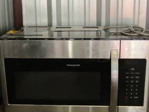lot 50 image: Frigidaire stainless steel above stove microwave, looks new missing the inside glass plate