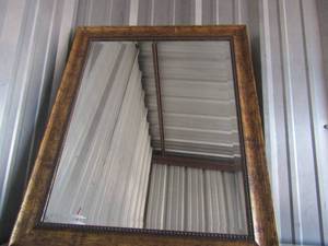 lot 84 image: Golden color framed mirror hangs on wall, size 35 12 29 12