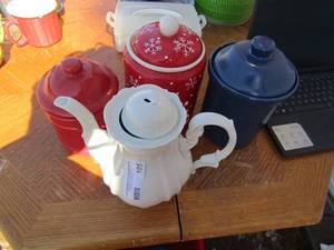 lot 105 image: Jacob Bavarian Germany white handled tea kettle top piece needs to be fixed comes with tea pot, Solid red covered canister, Solid blue covered canister, Christmas covered canister