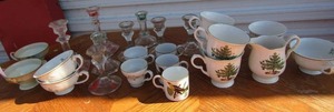 lot 111 image: large lot of various mini tea cups with dcor, 4 Nikko Christmas cups, and different size clear glass candle holders.
