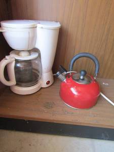 lot 116 image: white coffee pot and a red tea kettle