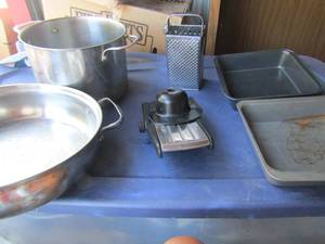 lot 127 image: 2 cheese graters, various used pots and pans, square baking dishes