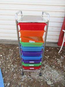 lot 132 image: 10 slot rolling storage ben, metal frame, top shelf, bens are removable