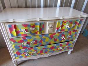 lot 38 image: 314018 white dresser 3 drawer, front has been painted multi color very sturdy