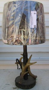 lot 9 image: 16 inch camouflage lamp made out of deer antlers 5 12 inches has a tree stump bottom