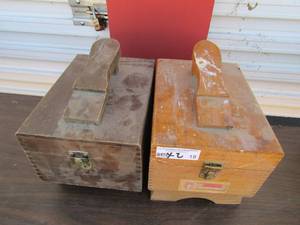 lot 18 image: 2 shoe shine kits with shoe soul holders, one is brown and one is dark grey, inside is used lot of shoe shine cleaners and polishes