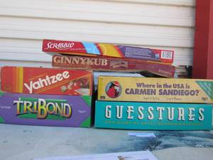 lot 20 image: Game lot includes, scrabble, Ginny Kub, where in the us is carmen Sandie go, triband, Yahtzee