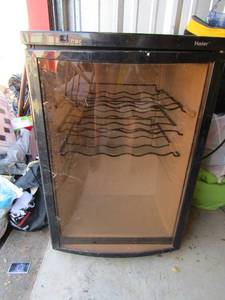 lot 2 image: HAIER Wine cooler with 3 racks, appears to be new, 302021  unknown working condition