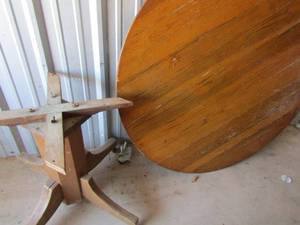 lot 45 image: 3154 diameter solid wood oval vintage dining table off the base but base is available on wheels, good condition