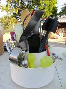 lot 212 image: spinning silverware and cooking utensil storage ben full of all kinds of kitchen utensils used