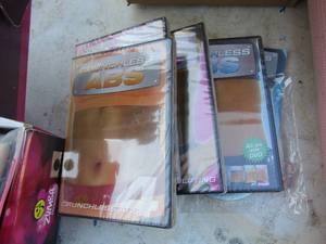lot 213 image: excursive lot includes, movies, yoga matt, exercise weight ball and a zombie starter kit