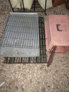 lot 231 image: metal black dog kennel with silver tray for bottom, and a small pink kennel for small animals