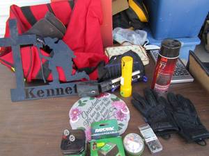 lot 233 image: Misc. lot of battery and chargers, red duffle bag, very large tv remote, gloves and more