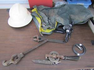 lot 245 image: Hard hat, small tarp, wrench, head lamp, some sort of pully by Lufkin, and more