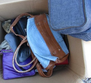 lot 254 image: Box of different brandsize purses most of them are used a few are new also has a few hats