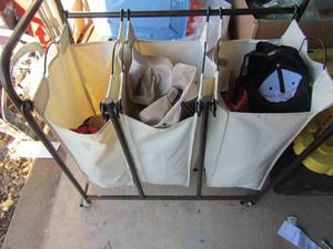 lot 240 image: Rolling basket with 3 compartment bags, inside holds various used mens and womens baseball caps and hats