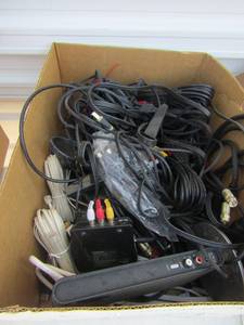 lot 22 image: white box of electronic plugs and cords