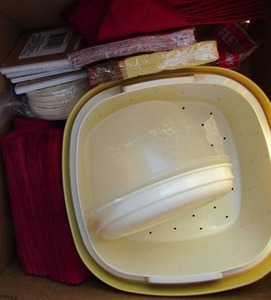lot 32 image: Napkins new in pack, plastic Tupperware bowls, drink coasters