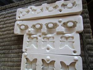 lot 56 image: butterfly macrame beads ceramic mold, pig napkin ring holder ceramic mold