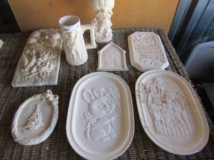lot 69 image: mold finishes owl, easter egg bird basket, bunny with roses, wall of fruit, minute man handled mug and baby Jesus