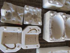 lot 73 image: ceramic mold including a large egg, teddy bear handle coffee mug and a bunny rabbit