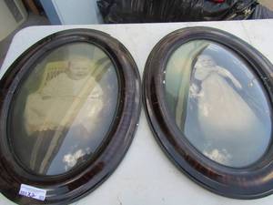 lot 83 image: 2 oval framed vintage baby photos unknown Arthur, size is 2519 qty 2