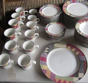 lot 105 image: Studio Nova China set palm dessert design includes, 8 saucers, 11 bread plates, 12 dinner plates, 12 soup bowls, 1 large serving plate, 8 coffee cups, 4 hot tea cups, qty all