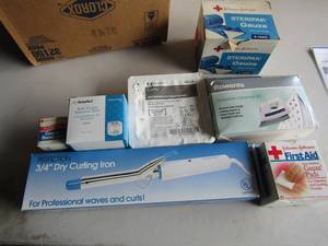 lot 110 image: Bathroom lot of first aid items such as bandages, gauze, wrap & Perfection dry curling iron, Iron soul plate cleaning kit
