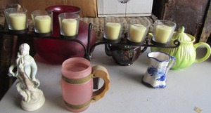 lot 114 image: large dark red center piece bowl, 6 tier votive candle holder for dcor, Corn on cob look handled tea pot, brown covered tea pot, handled pink siesta ware glass, Last sea ceramic creamer dish