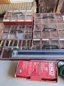 lot 117 image: 7 Handled screw,nail,and bolt compartment holders with handle qty 7, magnetic holder NIP, Box of 60 finishing nails, Sears 1.5 amp fully automatic onboard battery charger