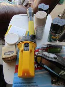 lot 118 image: toolshop lot includes, 2 cans satin enamel, 1 can of indooroutdoor wood finish, glash lights a car mirror, STP cabin filter and plumbing putty