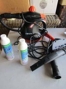 lot 123 image: Monster house hold steam booster with hoses used, 2 bottles of 24 clean blast chemicals