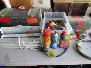 lot 135 image: 2 outdoor light fixtures and brackets, 2 empty tool boxes, plumbers tape, locks and more