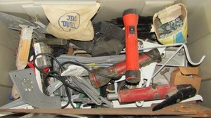 lot 141 image: Green and grey tub full of misc. tools such as, hand saw, hammers, flash lights, brackets, wire grill brush and more