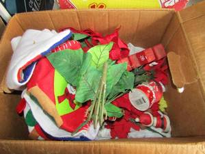 lot 148 image: Christmas lot includes stockings, small snowglobe, red plastic flowers,