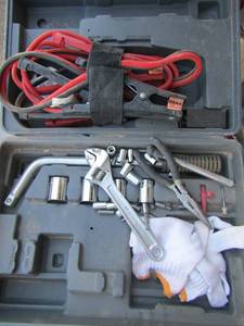 lot 16 image: black tool box of sockets, tire tool, jumper cables and more