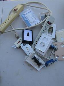 lot 12 image: Large lot of new and used wall plugscovers and wall plug plates and multi plug in plugs