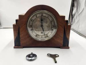 lot 3 image: Vintage Garrard Mantle Clock, Key, and pendulum weight. Made in England 1931