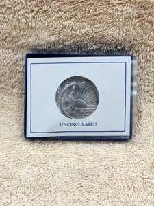 lot 13 image: 1986 Statue of Liberty Centennial Half Dollar - uncirculated