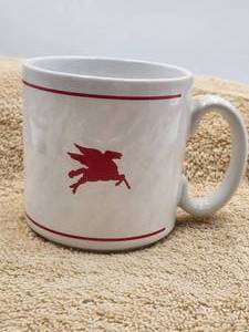 lot 16 image: Mobil oil coffee cup - Dallas where horses can fly