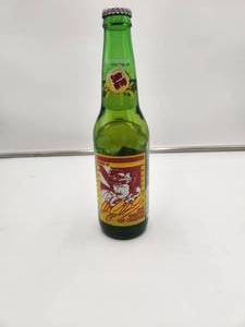 lot 32 image: 1980 Sun-Drop Dale Earnhardt Sr.- unopened soda bottle