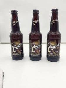 lot 40 image: Selection of 3 Coors Football themed bottles - unopened for collectible only