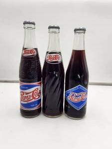 lot 78 image: Set of 3 Limited Edition Pepsi bottles