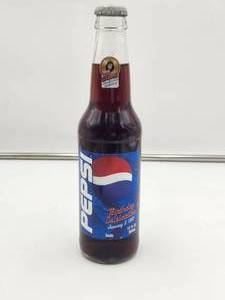 lot 106 image: 1999 Birthday Celebration Pepsi bottle - ELVIS - unopened