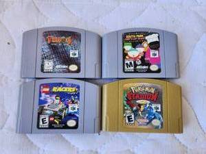 lot 30 image: Selection of 4 Nintendo 64 games, - Pokemon Stadium, Turok2, South Park, and Lego racers